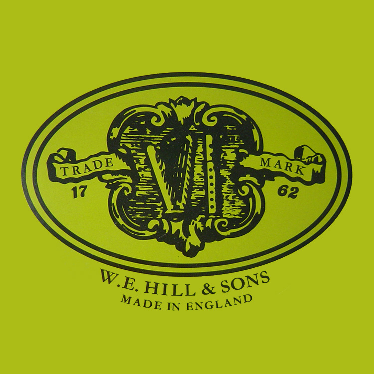 An ornate black design logo on a green background reads "Trade Mark 1762," with the initials "W E" and the name "W.E. Hill & Sons Made in England" below, associated with the product named Hill Light Violin Rosin.